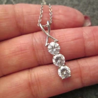 /public/photos/live/Three Stone Round Moissanite Bar Diamond Pendant  813 (1).webp